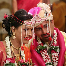 Second Couple seated together at the mandap